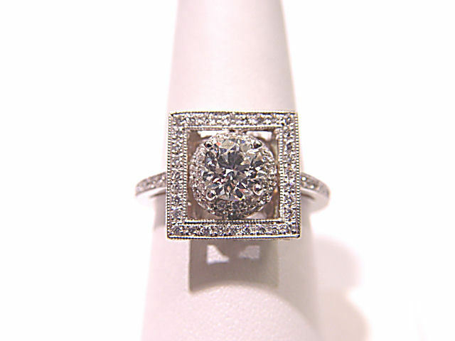 GIA CERTIFIED D:69% T:55% GIRDLE:TH TO EXTR THICK,FAC C:NONE ENGAGEMENT RING