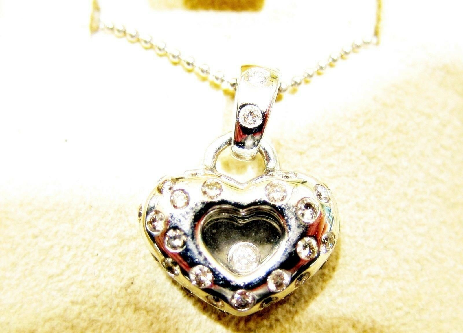 DIAMOND FLOATING ROUND BRILLIANT HEART SHAPE PENDANT