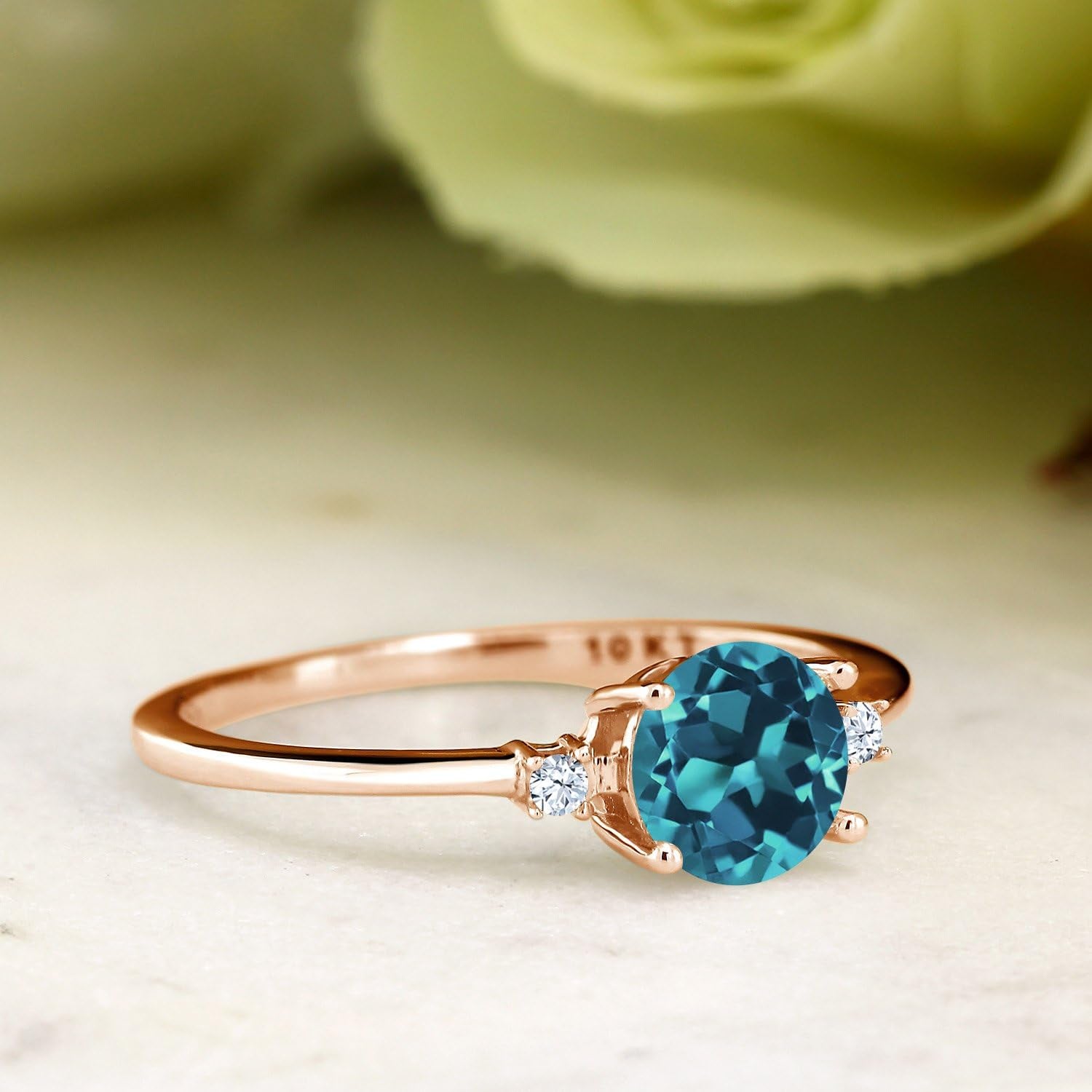 10K Rose Gold London Blue Topaz and White Created Sapphire Solitaire Engagement Ring for Women (0.78 Cttw, round 6MM, Gemstone November Birthstone, Available in Size 5,6,7,8,9)