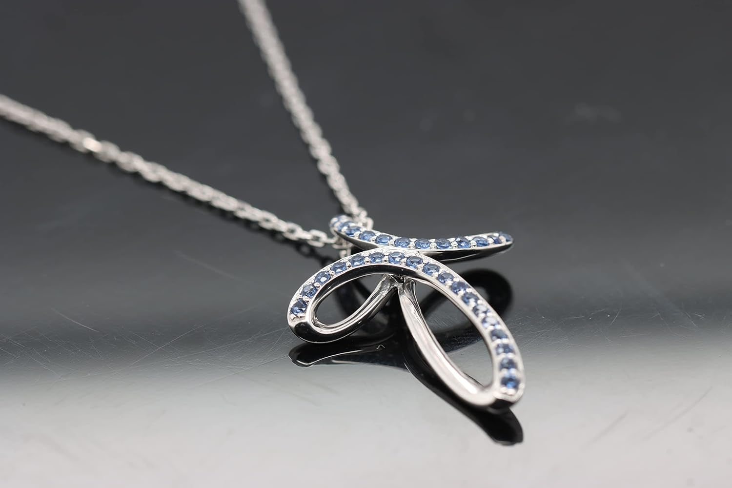 1.2MM round Cut Blue Sapphire Infinity Cross Necklace Pendant - 14K White Gold over 925 Sterling Silver Twist Cross Necklace for Women with 18" Chain (Clarity-Vvs1, Color-Blue, 0.12 Carat)